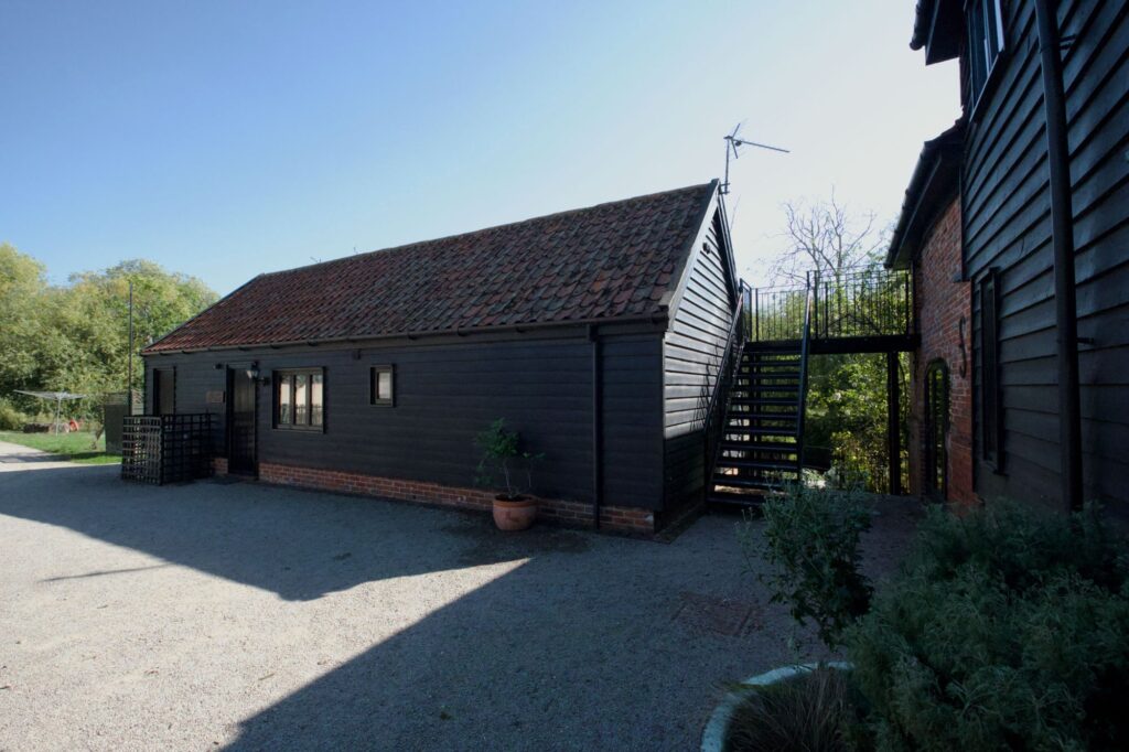 Willow Cottage from the courtyard, a single-storey barn with a tiled roof